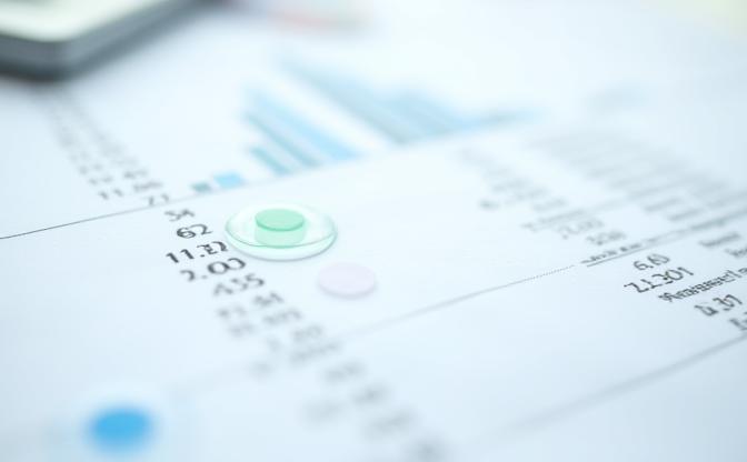 A detailed financial ledger or report with clear annotations and audit markers, symbolizing transparency and meticulous documentation in financial modeling.