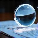 Magnifying glass over a document, symbolizing research