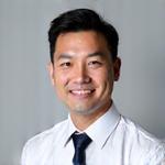 Professional portrait of Michael Wong, Compliance Specialist